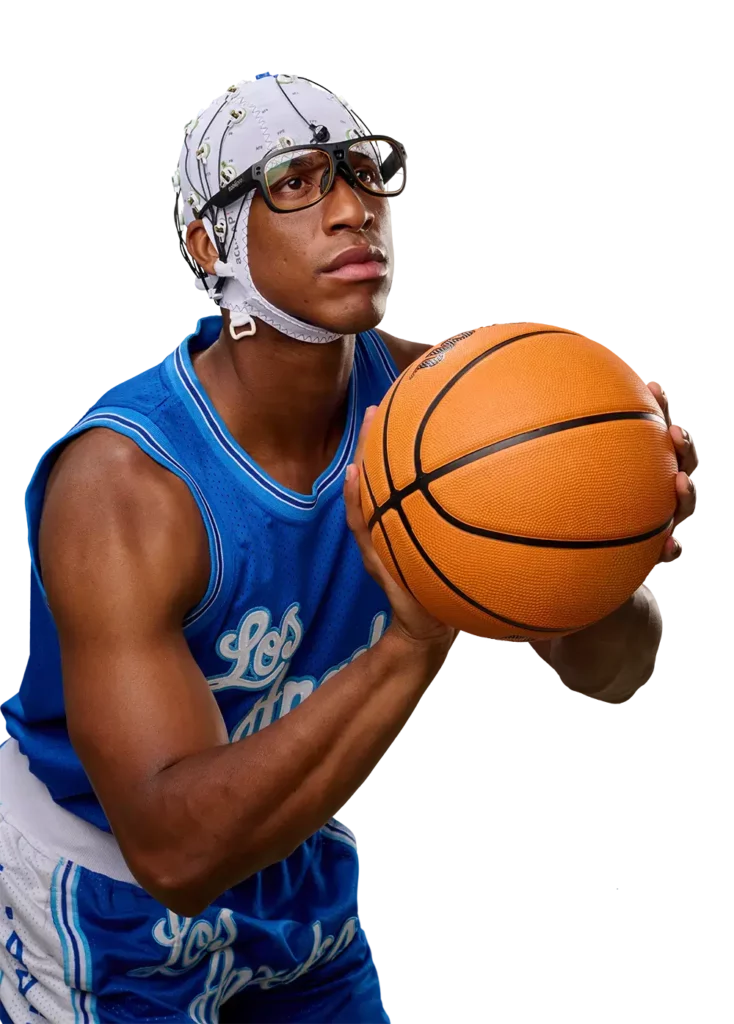 Basketball player wearing an EEG cap with integrated eye-tracking glasses, poised to take a shot while holding a basketball, dressed in a blue Los Angeles jersey